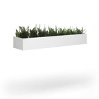 Rectangular white planter with artificial grass on a white background