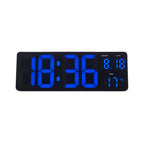 Digital clock with blue LED display on a white background